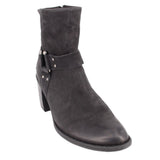 Black leather harness ankle boots with buckle strap across the shaft