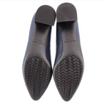 Pair of heels with textured rubber outsoles shown