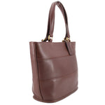 COACH Tribeca brown shopper bag shown from the side, with twin handles and gold-tone hardware
