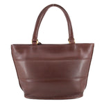 Back of the brown COACH Tribeca shopper bag with twin handles and stitched panels