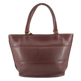 Back of the brown COACH Tribeca shopper bag with twin handles and stitched panels