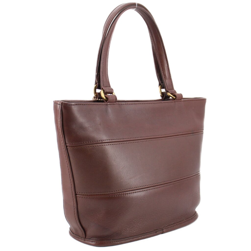 Angled back view of the brown COACH Tribeca shopper bag with stitched panels