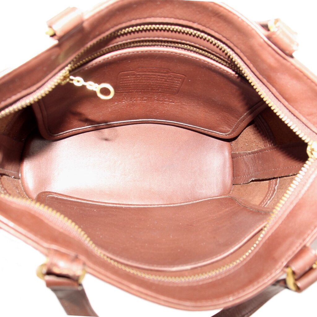 Open COACH Tribeca shopper bag showing brown lining, zip pocket and interior compartments