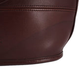 Close-up of brown shopper bag leather texture and stitched panel