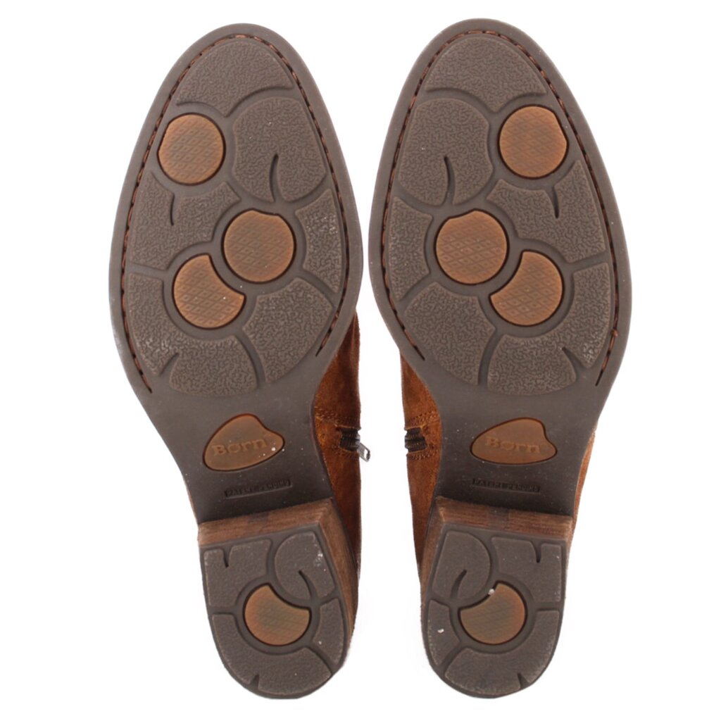 Brown suede ankle booties outsole view with textured tread