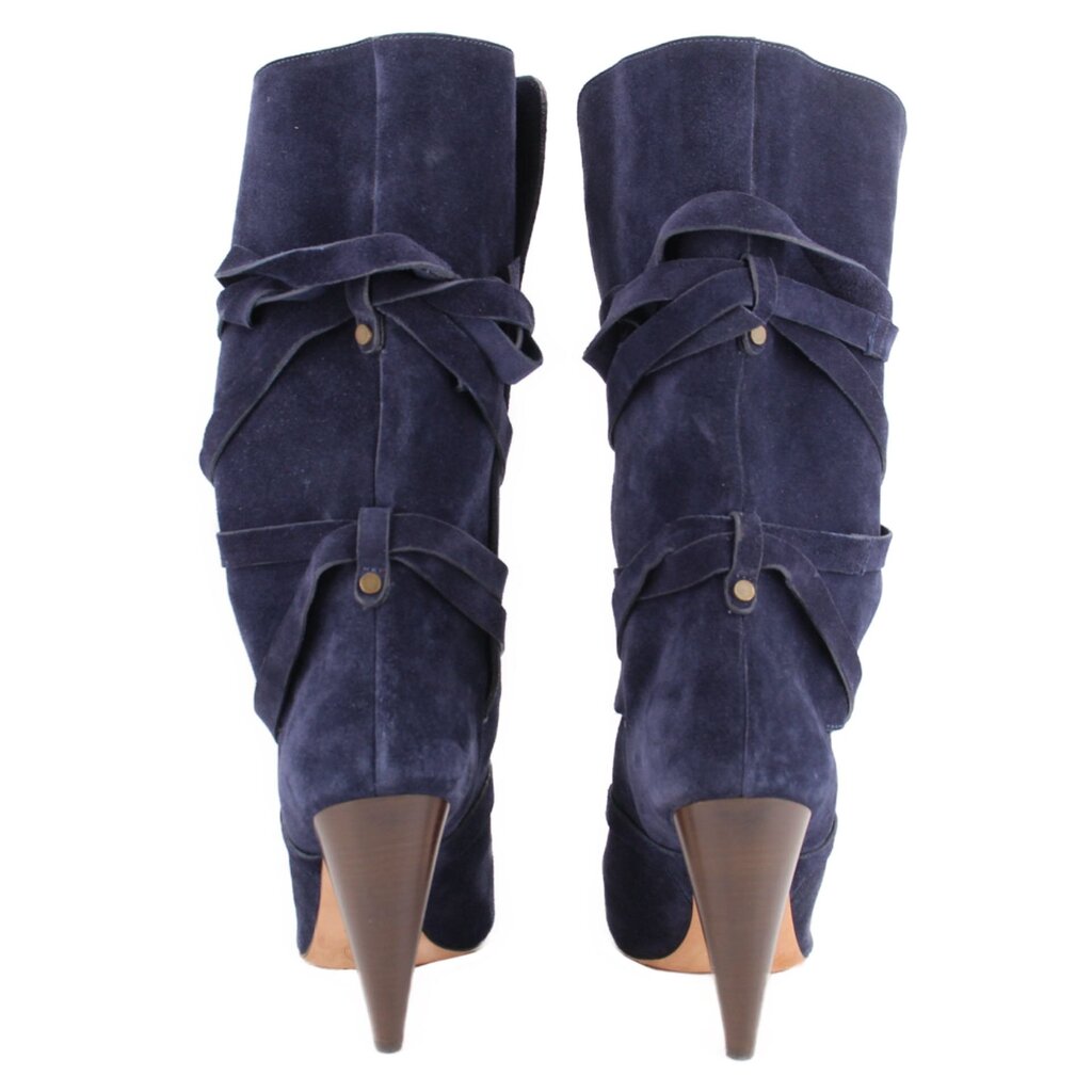Back view of navy suede slouch boots with wraparound straps and tapered heels