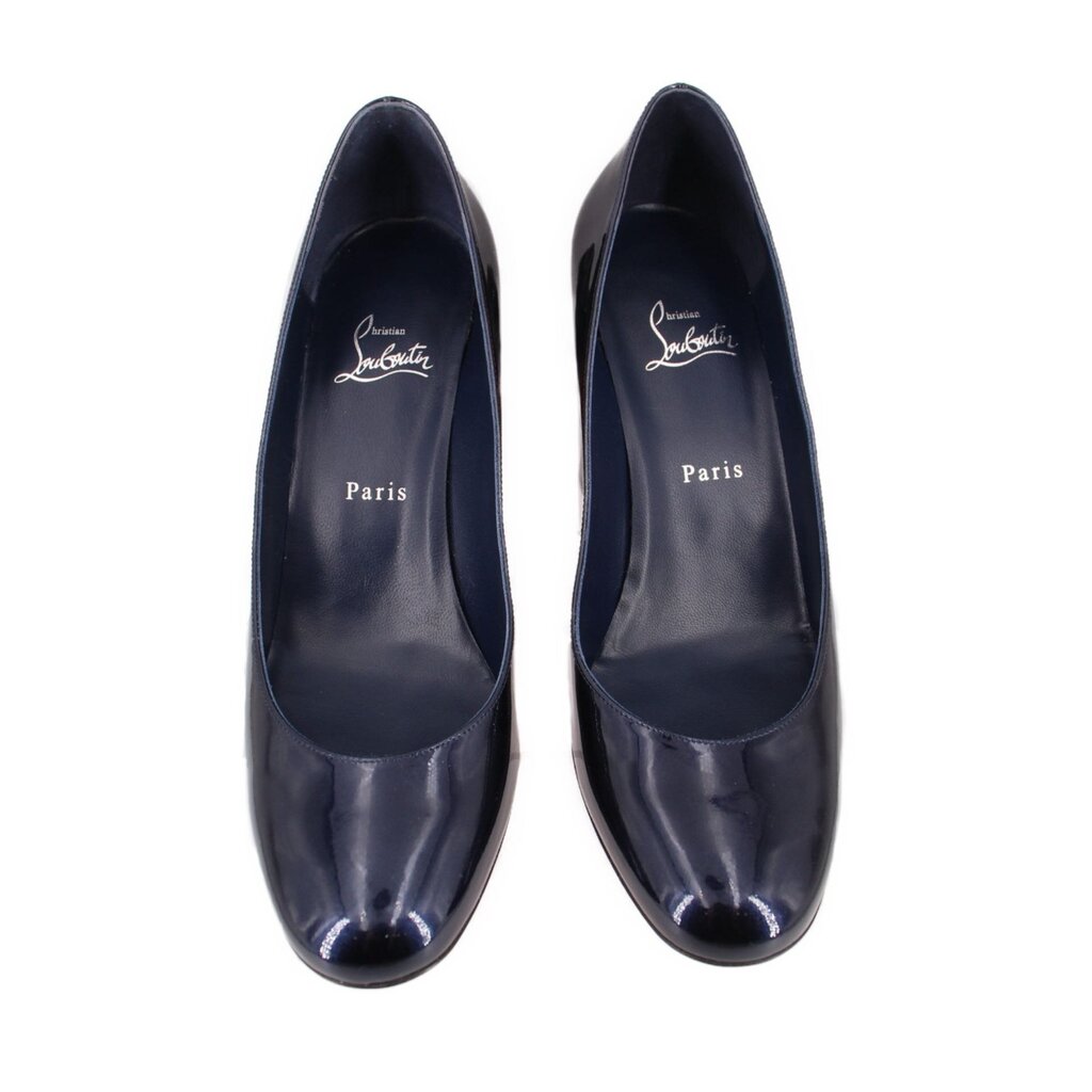 Pair of navy patent leather pointed-toe heels with red outsole accents