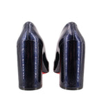 Back view of navy patent leather heels with high block heel and red inner trim