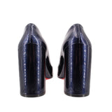 Back view of navy patent leather heels with high block heel and red inner trim