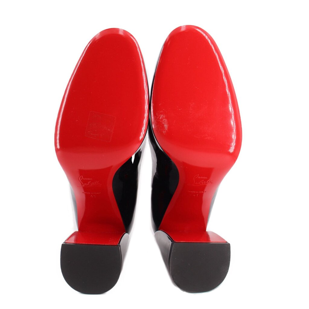 Navy patent leather heels with red soles and black heel tips