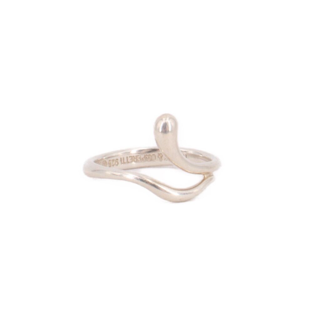 Tiffany & Co. sterling silver wave ring, side view showing its curved, overlapping band.