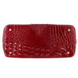 Merlot croc-embossed satchel bag front panel with two metal snap buttons