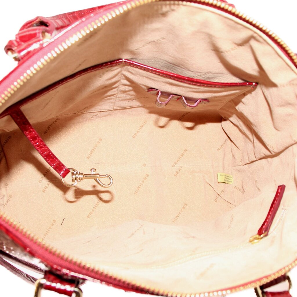 Merlot satchel interior with tan lining and zippered top opening