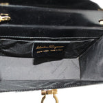 Crossbody bag interior view with brand label and gold clasp hardware