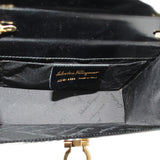 Crossbody bag interior view with brand label and gold clasp hardware