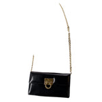 Black leather small crossbody bag with gold clasp and thin chain strap