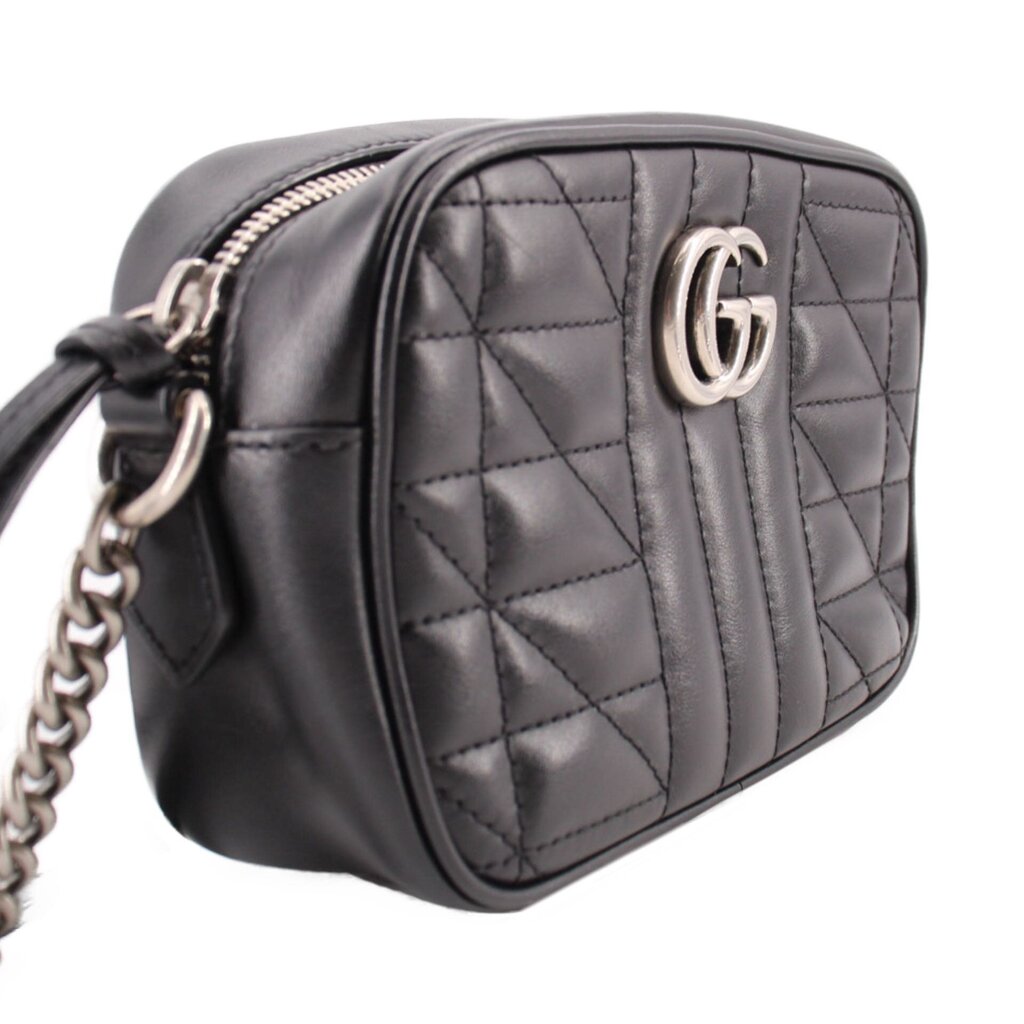 Black quilted mini crossbody bag with front GG emblem and adjustable strap