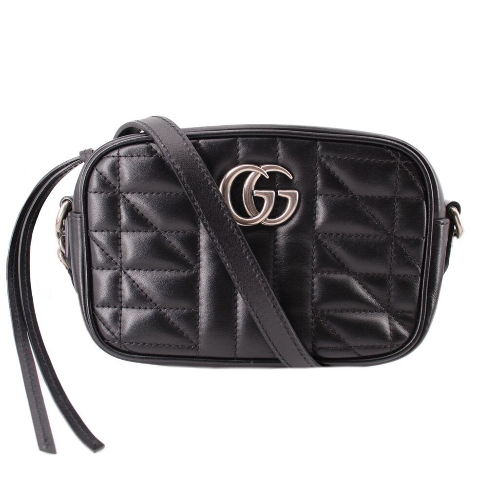 Black quilted mini crossbody bag with GG logo, top-zip and leather strap