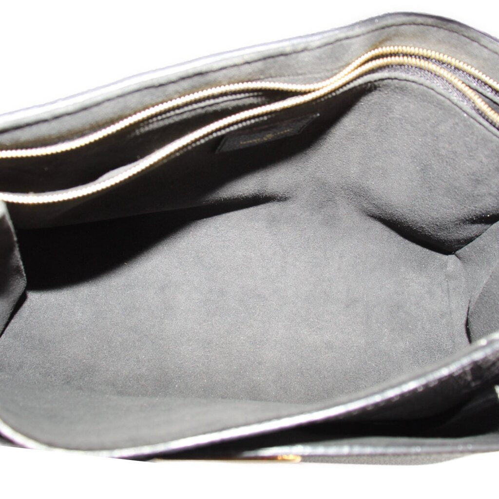 Open LOUIS VUITTON Vavin PM bag showing its dark lined interior and zip pocket