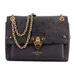 LOUIS VUITTON Vavin PM black crossbody bag with embossed pattern and gold chain