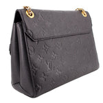 Angled back view of the black embossed LOUIS VUITTON Vavin PM bag
