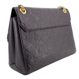 Angled back view of the black embossed LOUIS VUITTON Vavin PM bag