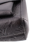 Close-up of the black leather corner and stitching on the LOUIS VUITTON Vavin PM bag
