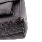 Close-up of the black leather corner and stitching on the LOUIS VUITTON Vavin PM bag