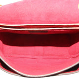 Interior view of monogram crossbody bag showing red fabric lining