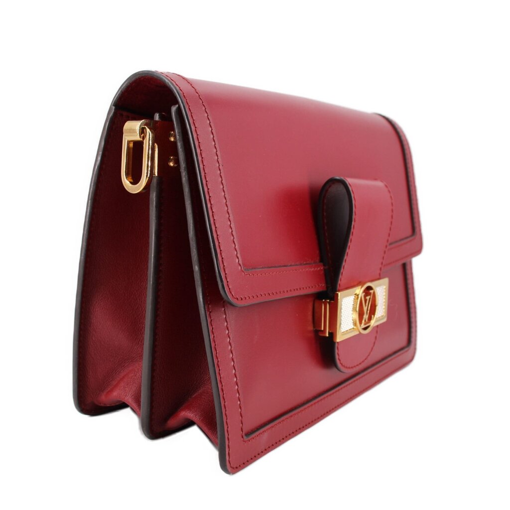 Cherry red leather crossbody bag side view with gold-tone clasp and flap detail