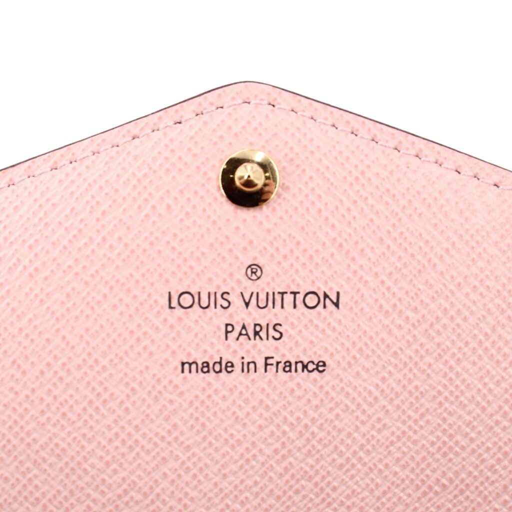 LOUIS VUITTON Sarah wallet, pink interior panel with logo text under snap