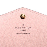 LOUIS VUITTON Sarah wallet, pink interior panel with logo text under snap