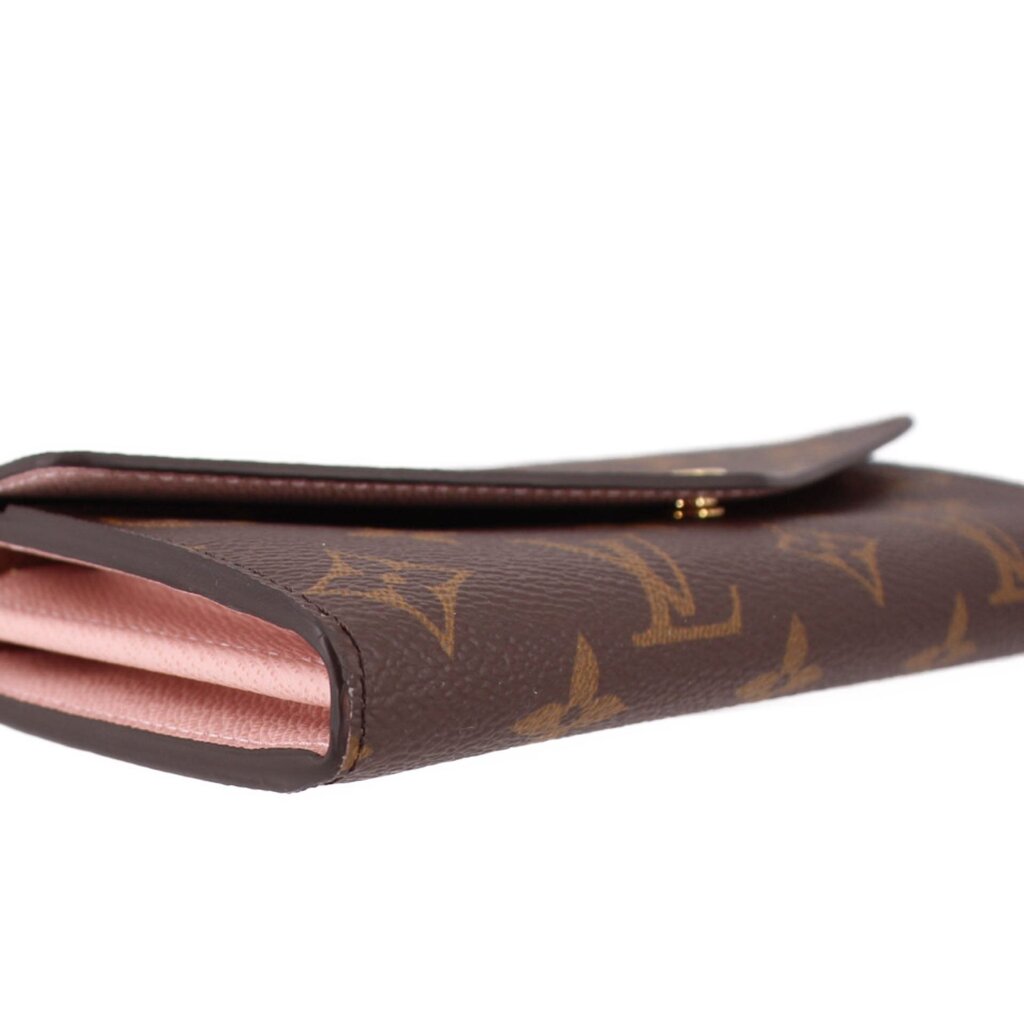LOUIS VUITTON Sarah wallet, close-up of brown monogram edge with pink lining