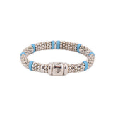 Sterling silver bead bracelet with blue ceramic spacers and a prominent clasp