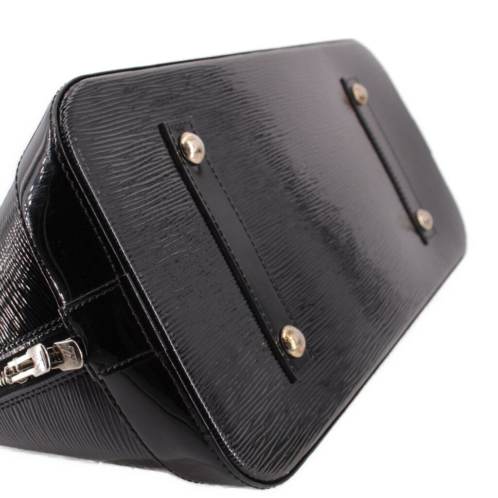 Louis Vuitton Alma GM handbag, close view of textured base and metal feet