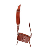 Rust leather snapshot camera bag with crossbody strap, front J logo and zipper