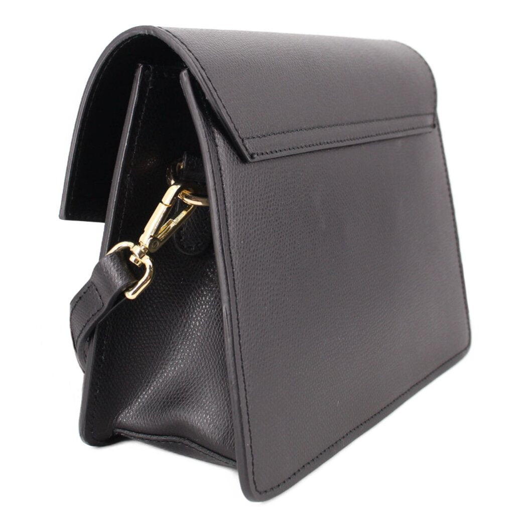 Black crossbody bag profile view with gold clasp hardware and side stitching