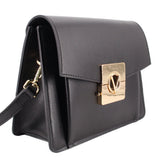 Black crossbody bag with flap closure and gold square logo clasp