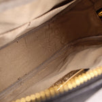 Crossbody bag interior lining with zip pocket and gold-tone zipper pull