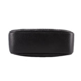 Black leather crossbody bag back view, smooth pebbled texture