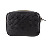 Black monogram crossbody bag with top zipper and gold-tone trim