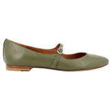 Side profile of a green leather flat with a low heel and adjustable buckle strap