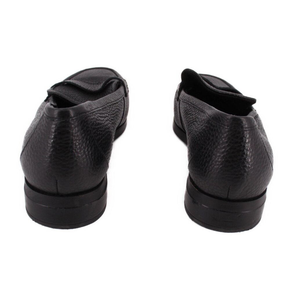 Pair of VIONIC black leather loafers viewed from the back, showing low heels