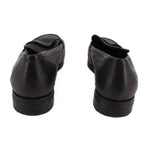 Pair of VIONIC black leather loafers viewed from the back, showing low heels