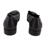 Pair of VIONIC black leather loafers viewed from the back, showing low heels