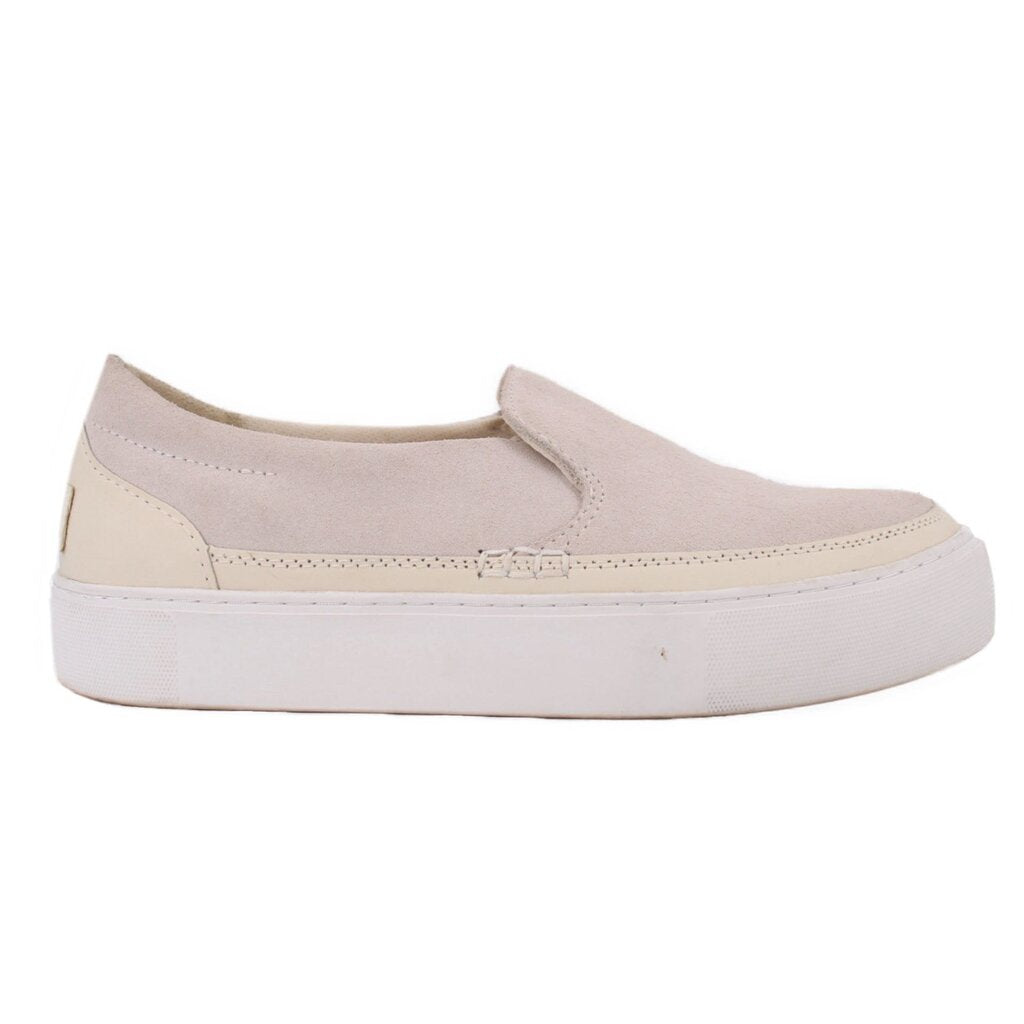 UGG cream suede flat shown from the side, with a thick white platform sole
