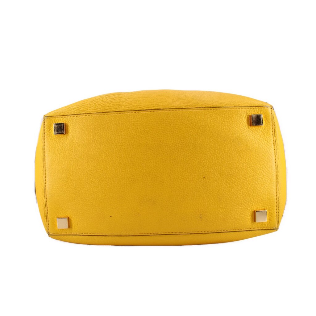 Yellow leather tote base with four metal protective feet
