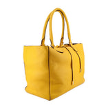Yellow pebbled leather tote, angled view showing its side gusset and double handles