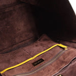 Tote interior with brown lining, zip pocket, and MICHAEL KORS label