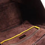 Tote interior with brown lining, zip pocket, and MICHAEL KORS label